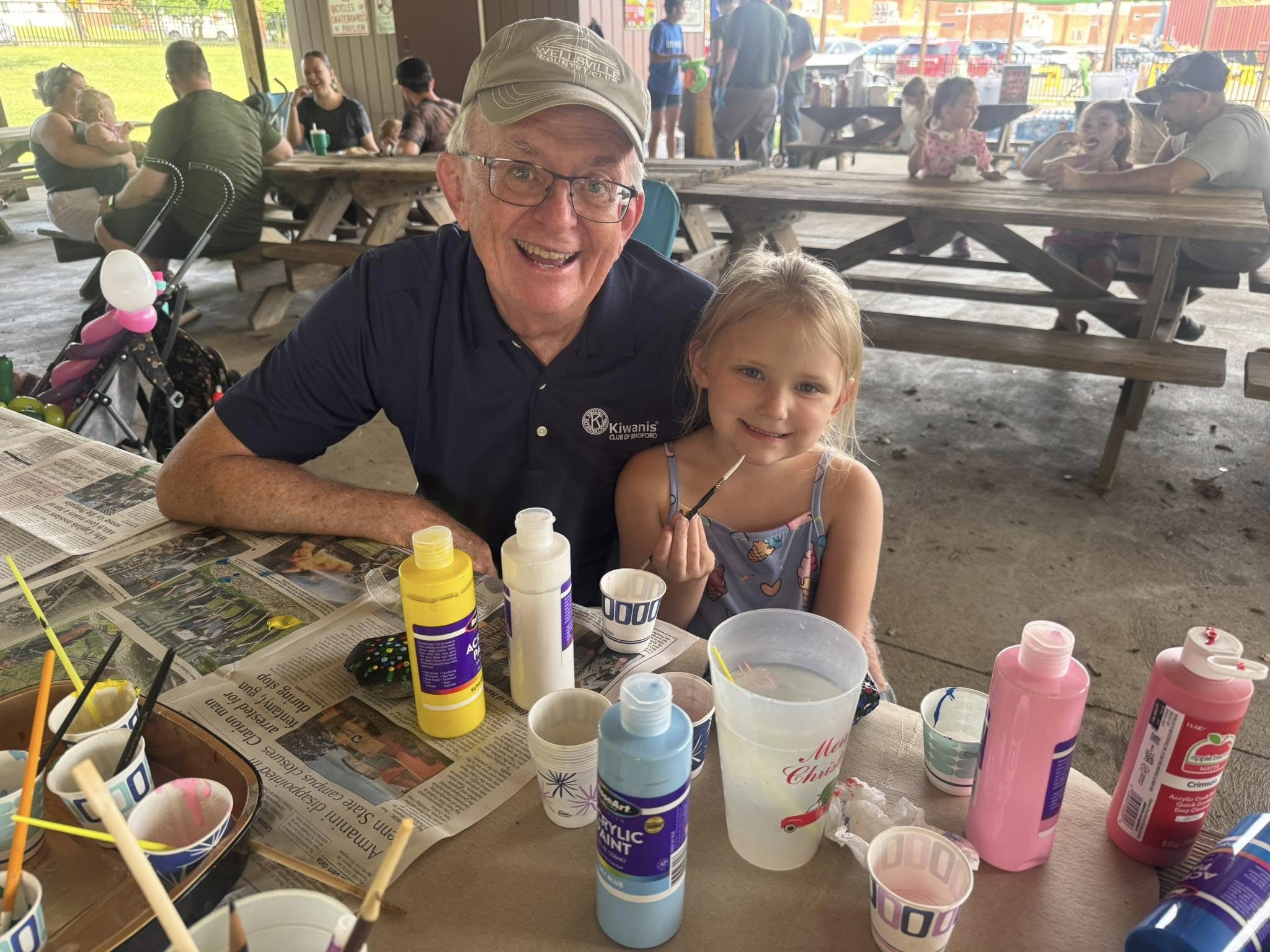 Image of Pat Ryan helping Inez Quick, daughter of Kiwanians Trevor Quick and Christine Stromness | Kiwanis Club of Bradford